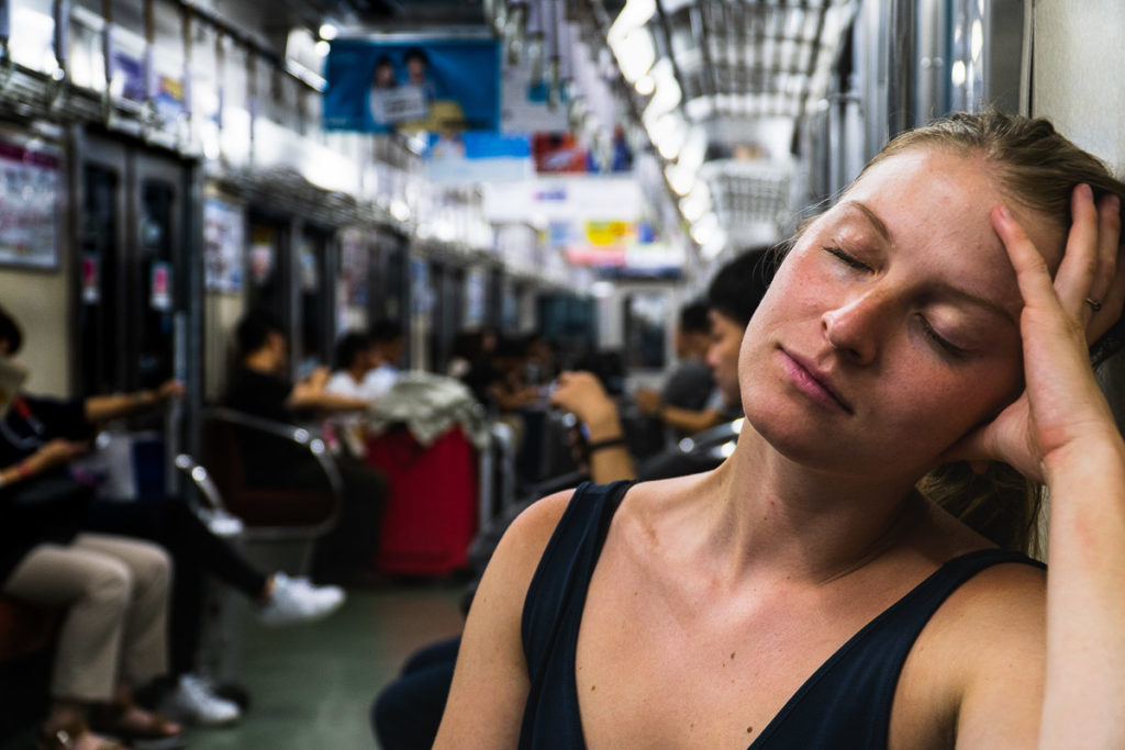 Me looking tired while riding the subway in Japan.