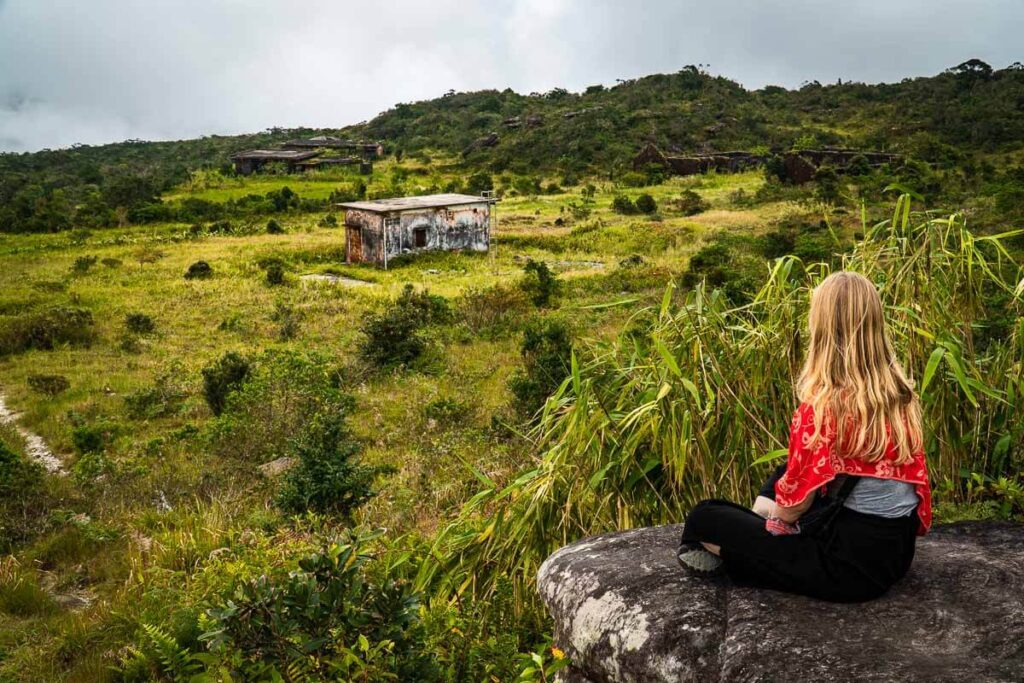 Me overlooking old abandoned buildings at Bokor in Cambodia