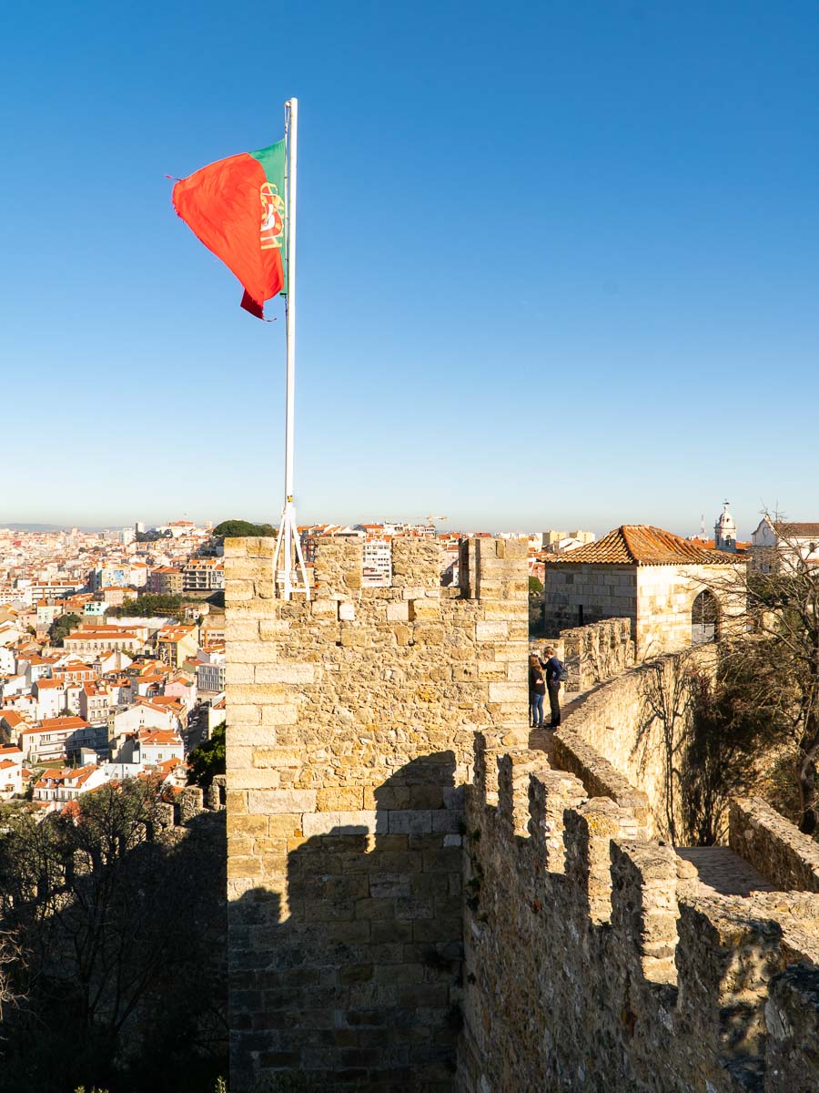 A tower in Lisbon castle and the Portuguese flag